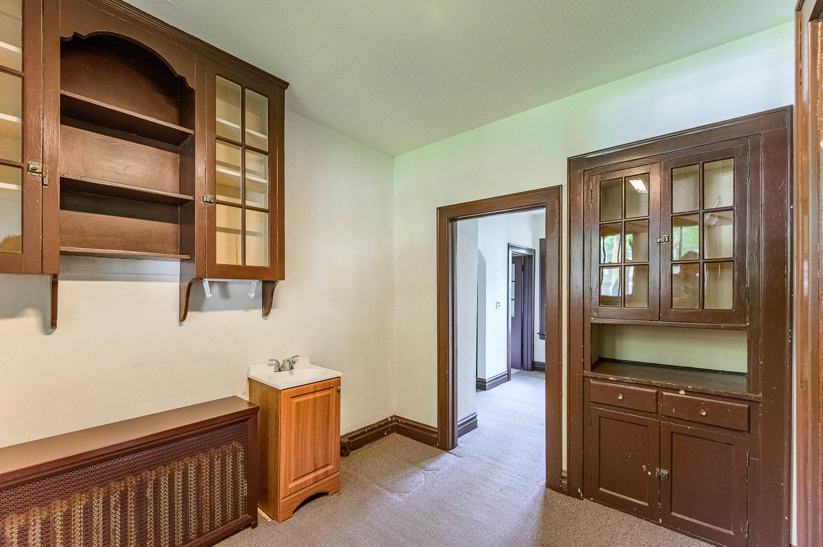 104 Washington Road Lake Forest, IL 60045 - Photo 6 of 17 a hallway with cabinets and wooden floor