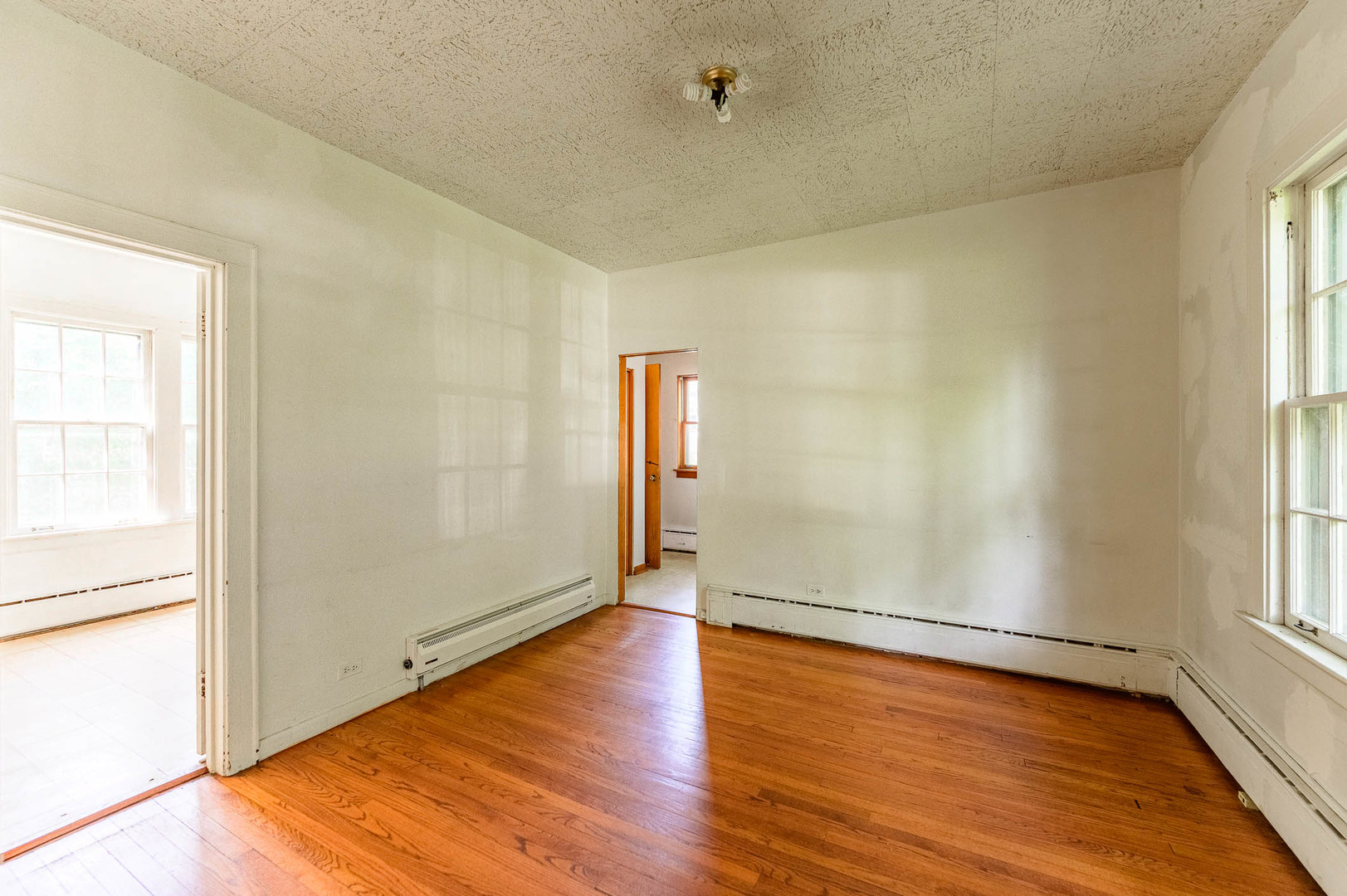 104 Washington Road Lake Forest, IL 60045 - Photo 7 of 17 an empty room with wooden floor and windows