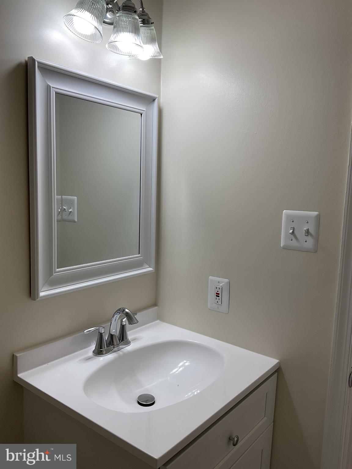 2001 Powder Horn Drive Fort Washington, MD 20744 - Photo 19 of 26 a bathroom with a sink and a mirror