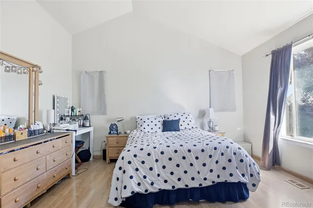 a bedroom with a bed and a closet