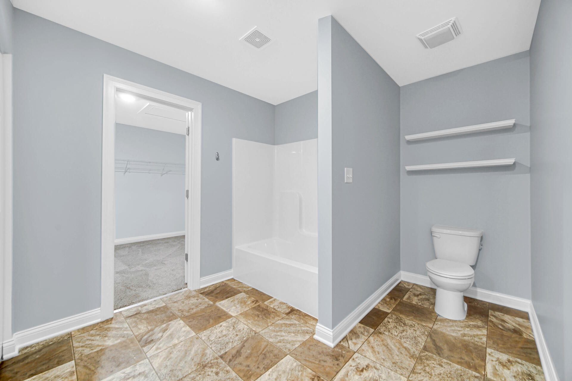 7428 East 120th Avenue Crown Point, IN 46307 - Photo 18 of 28 a bathroom with a toilet and a shower