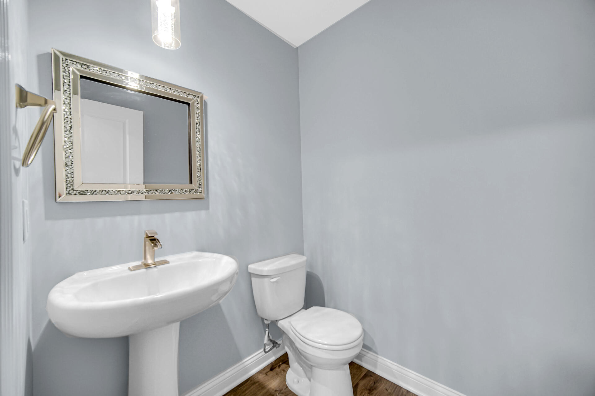 7428 East 120th Avenue Crown Point, IN 46307 - Photo 5 of 28 a bathroom with a toilet sink and mirror