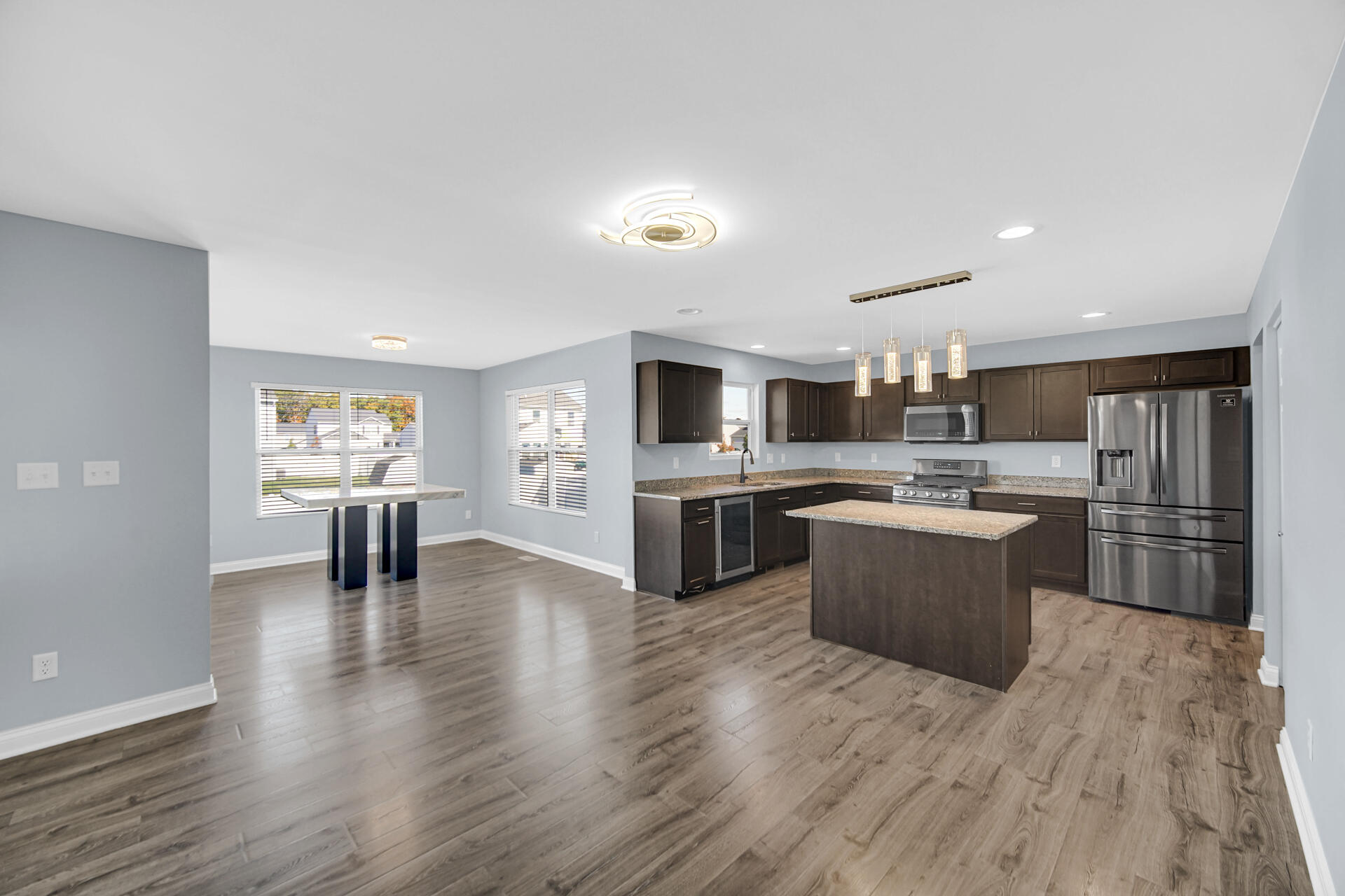 7428 East 120th Avenue Crown Point, IN 46307 - Photo 8 of 28 a kitchen with a sink cabinets and wooden floor