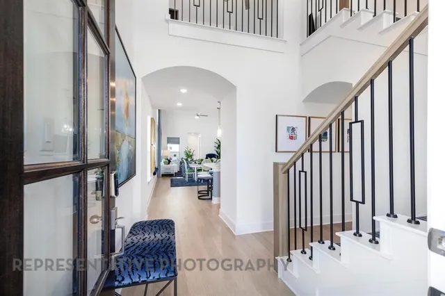 a view of entryway and hall with wooden floor