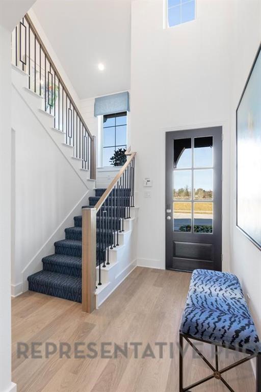 3909 Script Street Prosper, TX 75078 - Photo 12 of 25 a view of entryway and hall with wooden floor