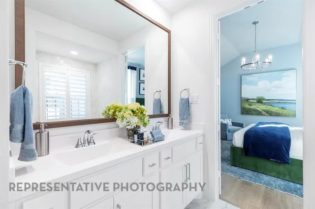 a bathroom with a double vanity sink and a mirror