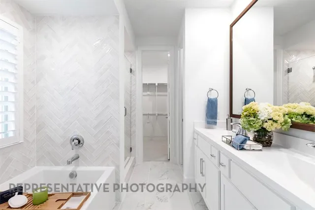 a bathroom with a granite countertop sink a toilet and shower