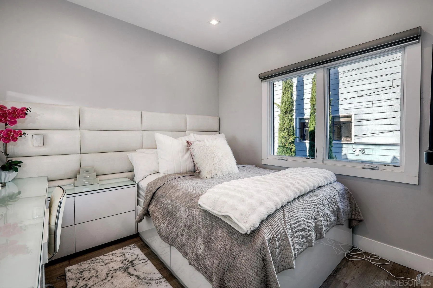 911 9th Street Coronado, CA 92118 - Photo 26 of 45 a bedroom with a large bed and a large window