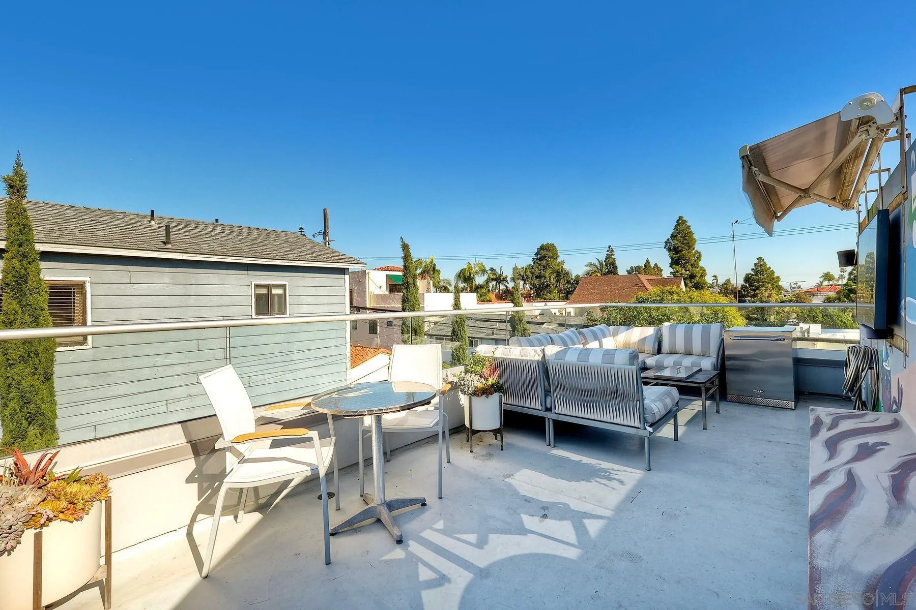 911 9th Street Coronado, CA 92118 - Photo 28 of 45 a view of a terrace with furniture and a fire pit