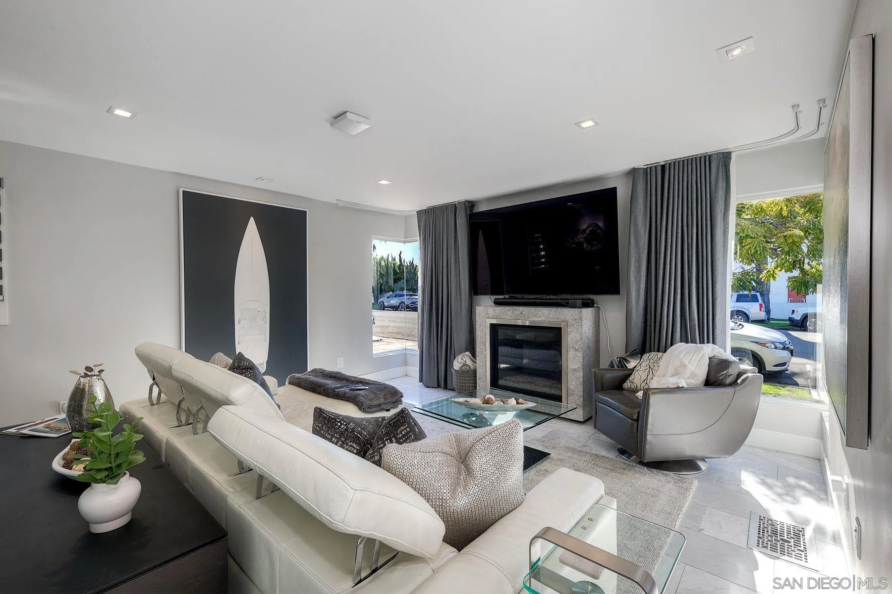 911 9th Street Coronado, CA 92118 - Photo 5 of 45 a living room with fireplace furniture and a flat screen tv