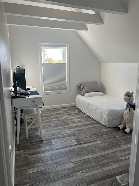 15 Neptune St Court Lynn, MA 01905 - Photo 19 of 35 a bedroom with a bed and wooden floor