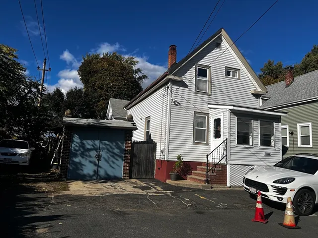 a car parked in front of a house