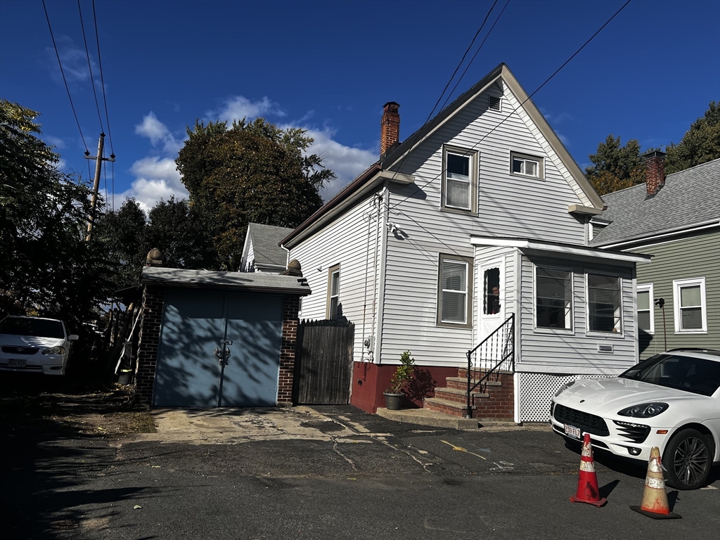 15 Neptune St Court Lynn, MA 01905 - Photo 2 of 35 a car parked in front of a house