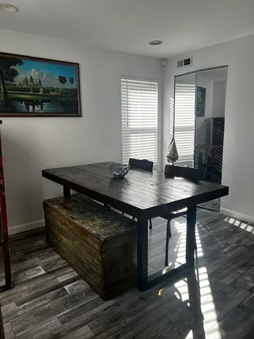 a view of a workspace with furniture