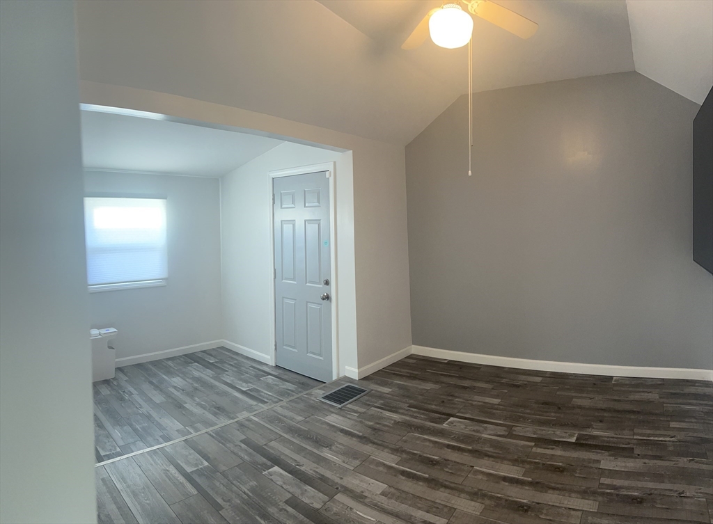 15 Neptune St Court Lynn, MA 01905 - Photo 33 of 35 a view of an empty room with wooden floor and a window