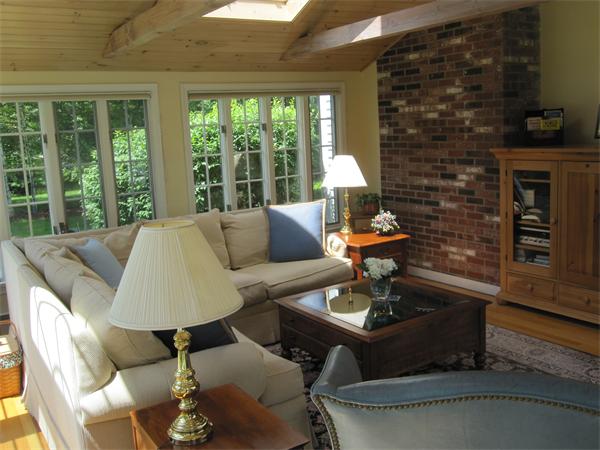 29 Spartan Arrow Road Littleton, MA 01460 - Photo 17 of 30 a living room with furniture and a fireplace