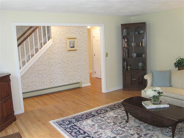 29 Spartan Arrow Road Littleton, MA 01460 - Photo 19 of 30 a living room with furniture and wooden floor