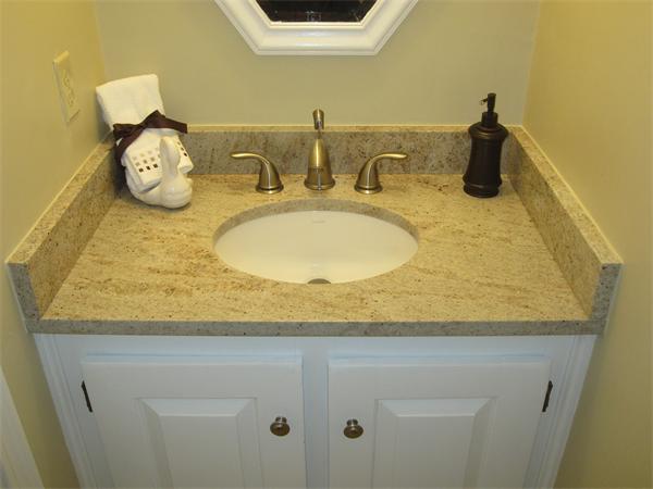 29 Spartan Arrow Road Littleton, MA 01460 - Photo 26 of 30 a bathroom with a granite countertop sink and a mirror