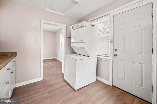 a view of kitchen with wooden floor and electronic appliances