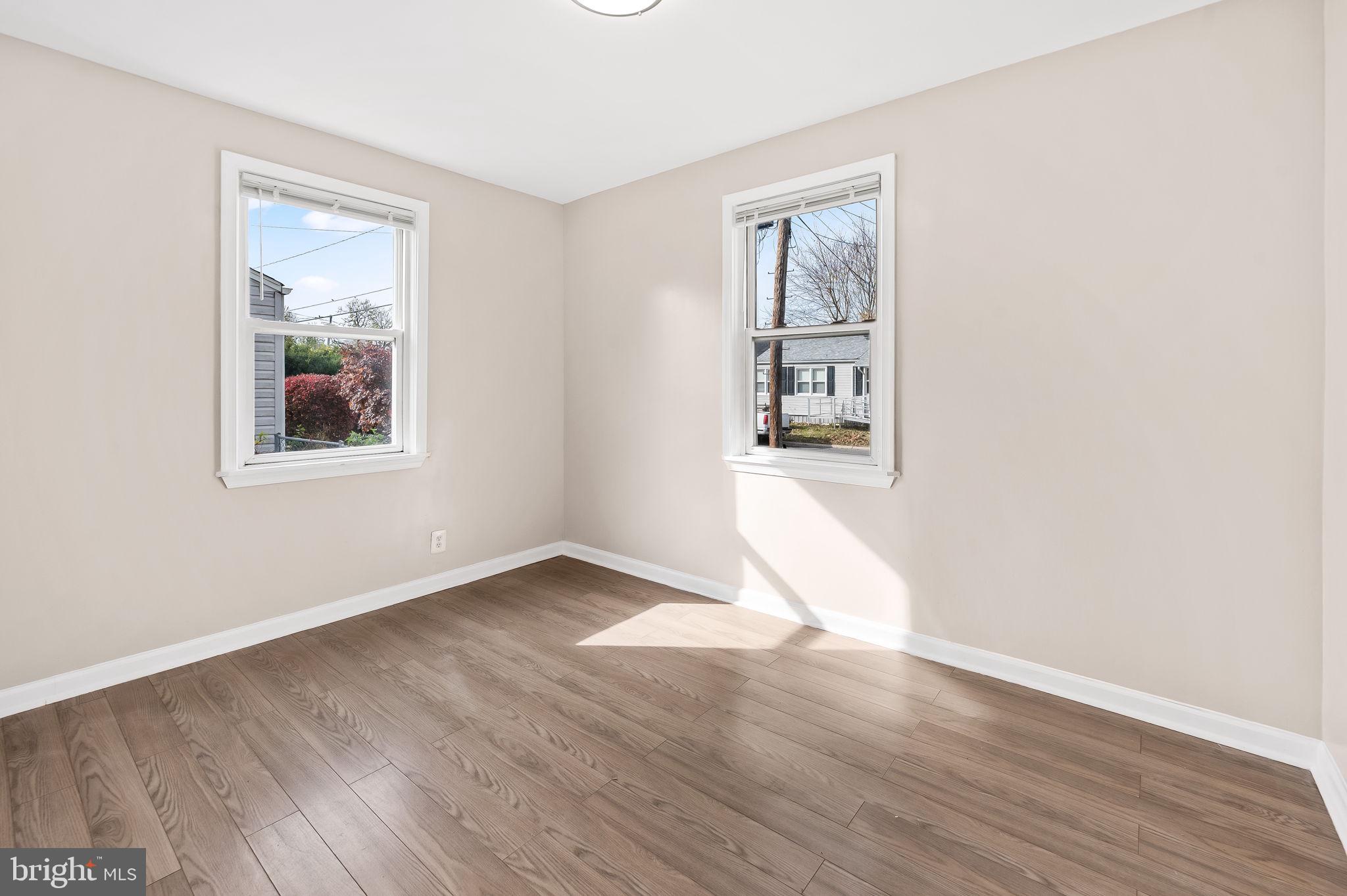 46 Aberdeen Avenue Aberdeen, MD 21001 - Photo 12 of 23 an empty room with wooden floor and windows