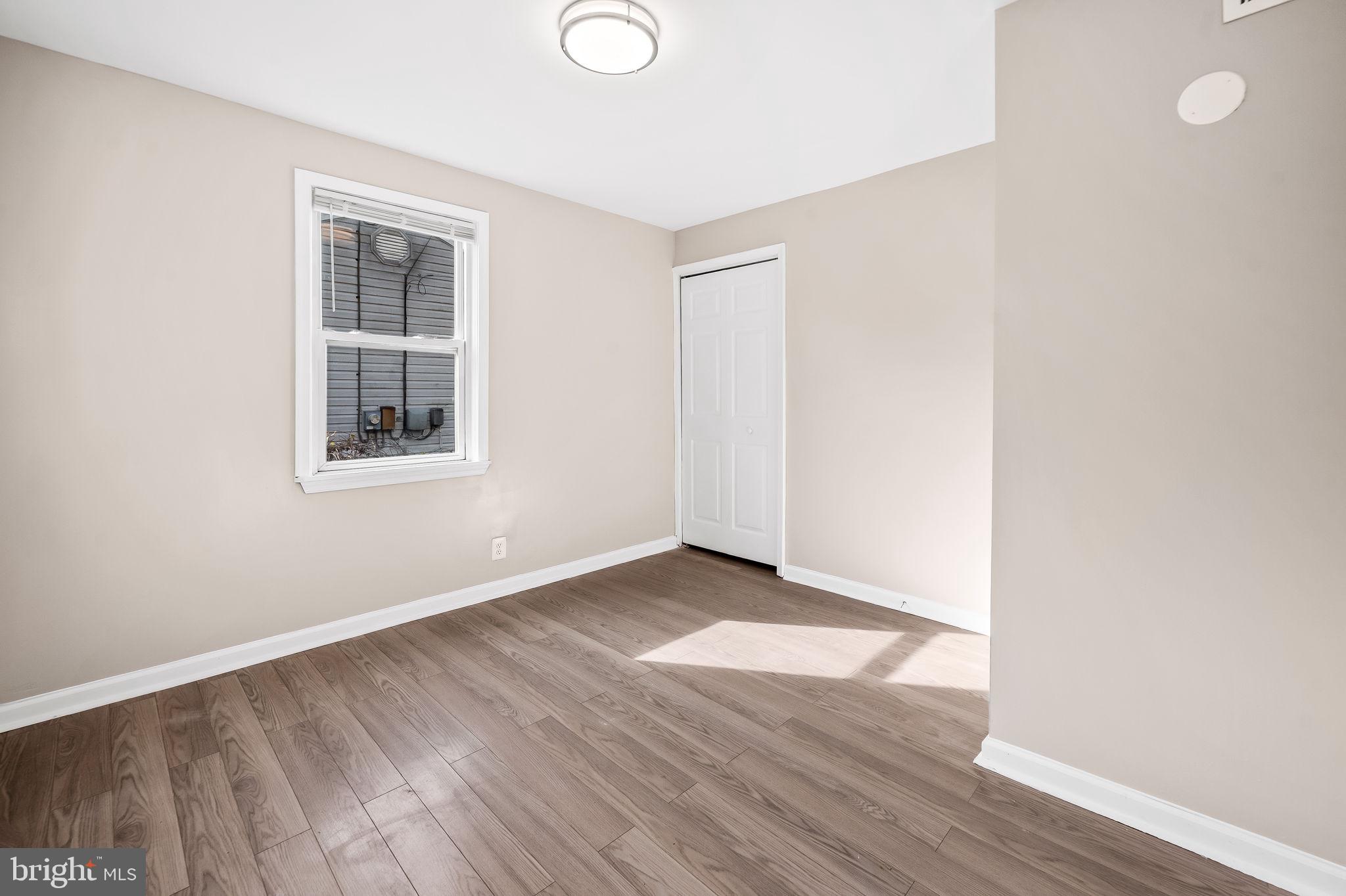 46 Aberdeen Avenue Aberdeen, MD 21001 - Photo 17 of 23 an empty room with wooden floor and windows
