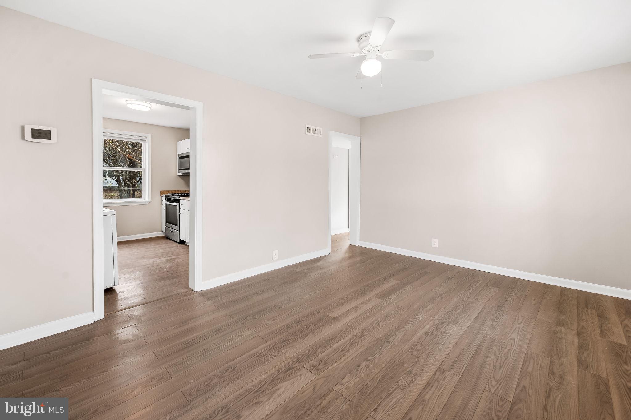 46 Aberdeen Avenue Aberdeen, MD 21001 - Photo 6 of 23 an empty room with wooden floor and ceiling fan