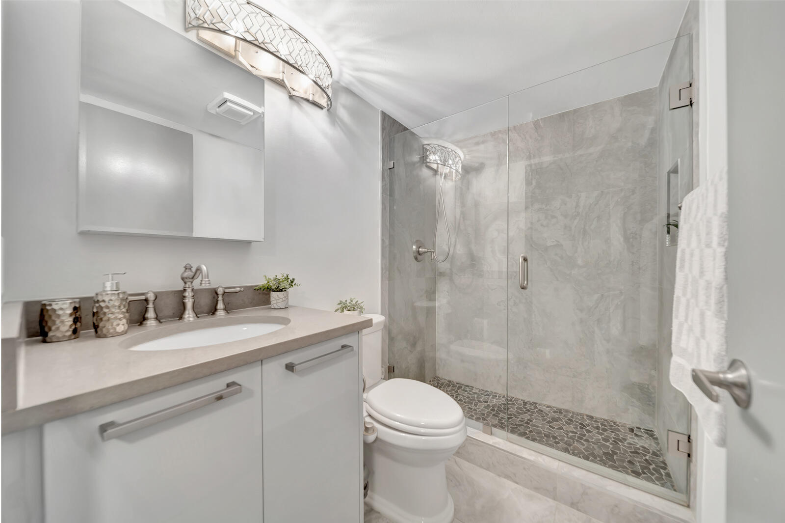4063 Exeter Boca Raton, FL 33434 - Photo 23 of 55 a bathroom with a sink a toilet and shower