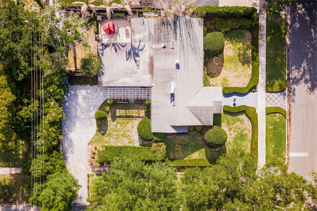 1001 Nottingham Street Orlando, FL 32803 - Photo 45 of 49 a aerial view of a house with swimming pool and large trees