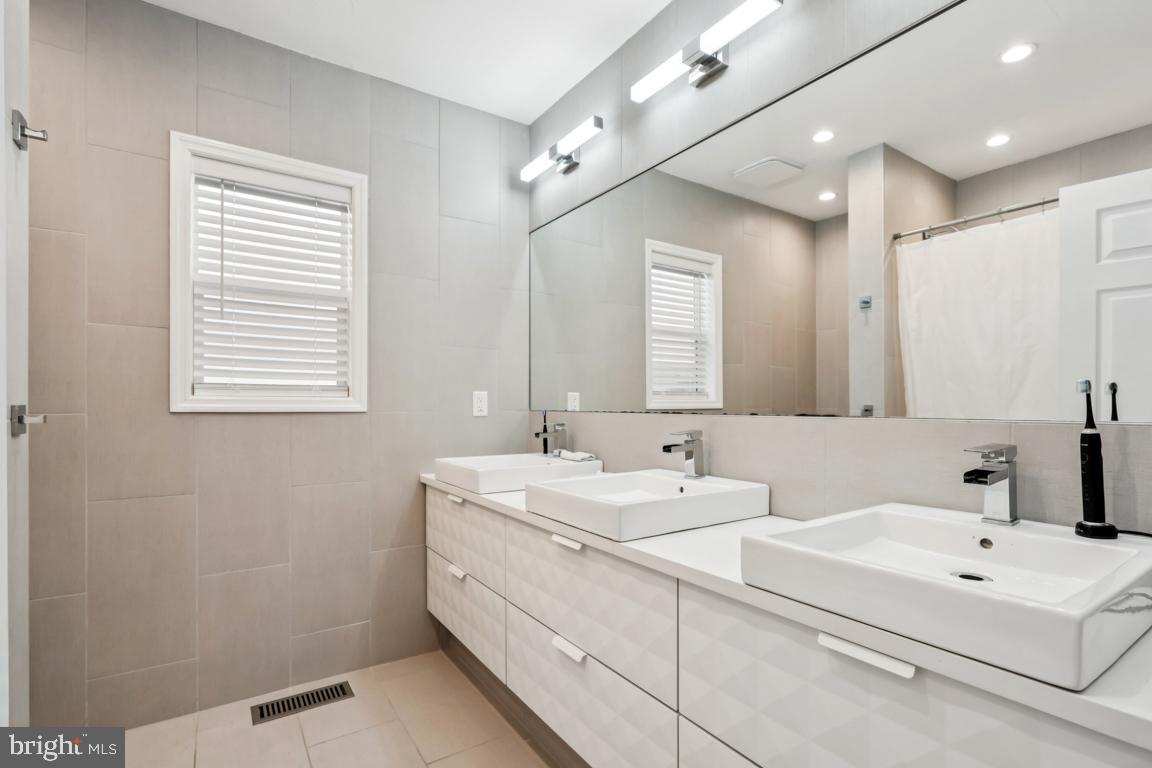 9 North Lenola Road Moorestown, NJ 08057 - Photo 16 of 25 a bathroom with a sink and a mirror