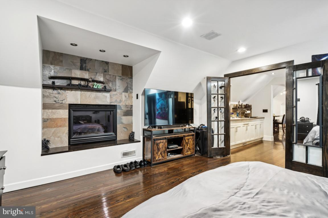 9 North Lenola Road Moorestown, NJ 08057 - Photo 22 of 25 a living room with furniture flat screen tv and a fireplace