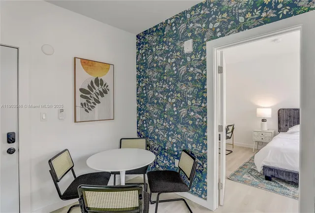 a bedroom with a bed and a chair in it