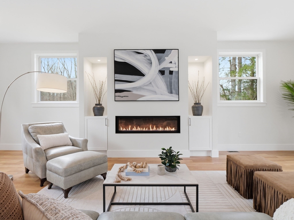 22 Lincoln Road Lincoln, MA 01773 - Photo 18 of 42 a living room with furniture and a fireplace