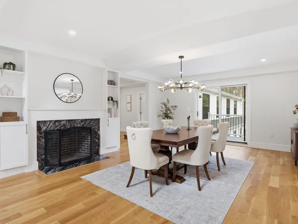 a living room with furniture and floor to ceiling windows