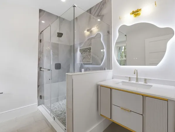 a utility room with sink dryer and washer