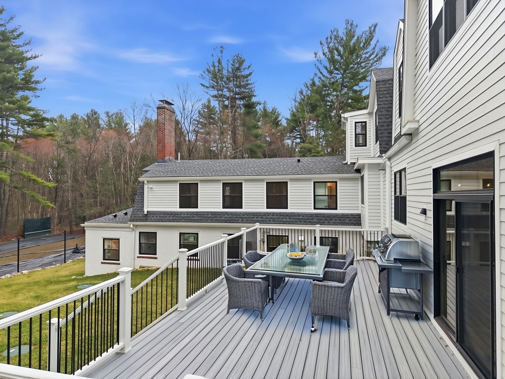 22 Lincoln Road Lincoln, MA 01773 - Photo 42 of 42 a view of a house with a patio and a yard