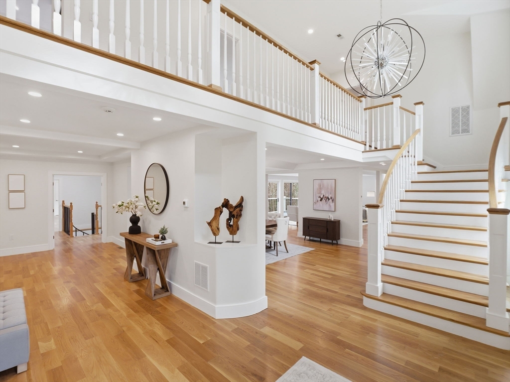 22 Lincoln Road Lincoln, MA 01773 - Photo 7 of 42 a view of a livingroom with wooden floor and a ceiling fan