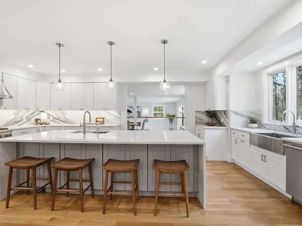 a kitchen with stainless steel appliances a stove sink and microwave