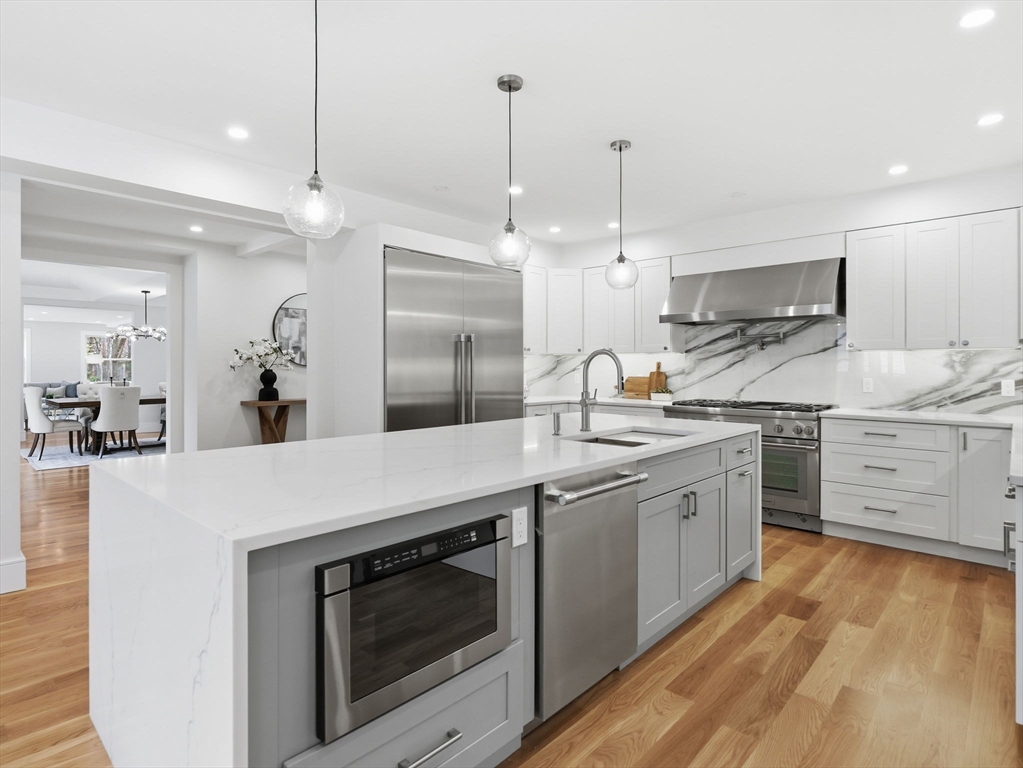 22 Lincoln Road Lincoln, MA 01773 - Photo 9 of 42 a kitchen with stainless steel appliances a stove sink and microwave