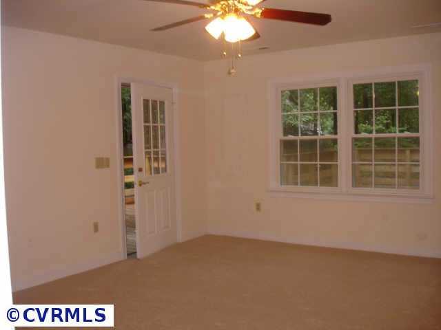 13217 Queensgate Road Midlothian, VA 23114 - Photo 7 of 10 Other - Master Bedroom opens to deck, has double window, walk-in closet, 6x6 vanity area +11' bathroom with roll-in shower and standard tub with shower, ceramic tile floor and tile/marble surround on all walls.
