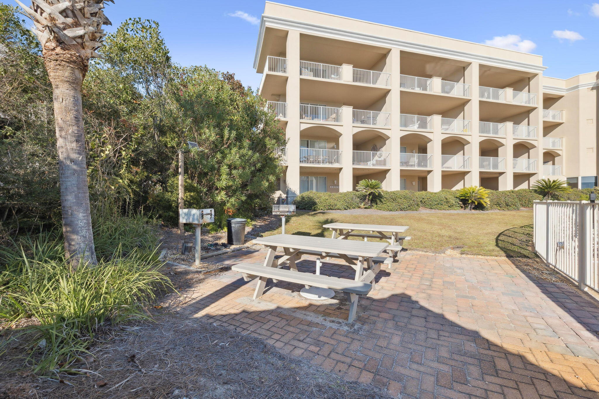 4045 West County Highway 30A, Unit 108 Santa Rosa Beach, FL 32459 - Photo 26 of 29 a view of a patio with a table and chairs