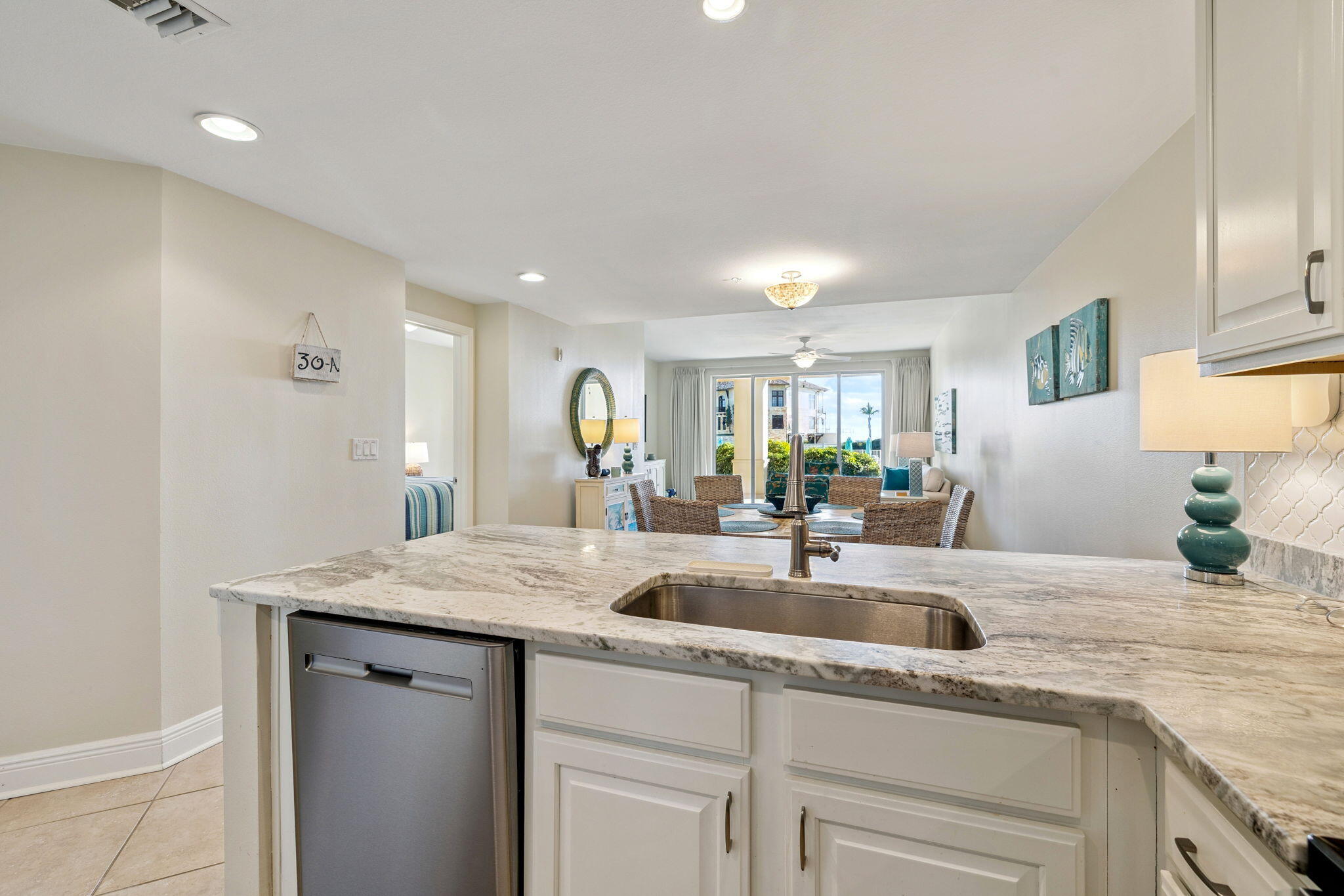4045 West County Highway 30A, Unit 108 Santa Rosa Beach, FL 32459 - Photo 7 of 29 a kitchen with a sink and cabinets