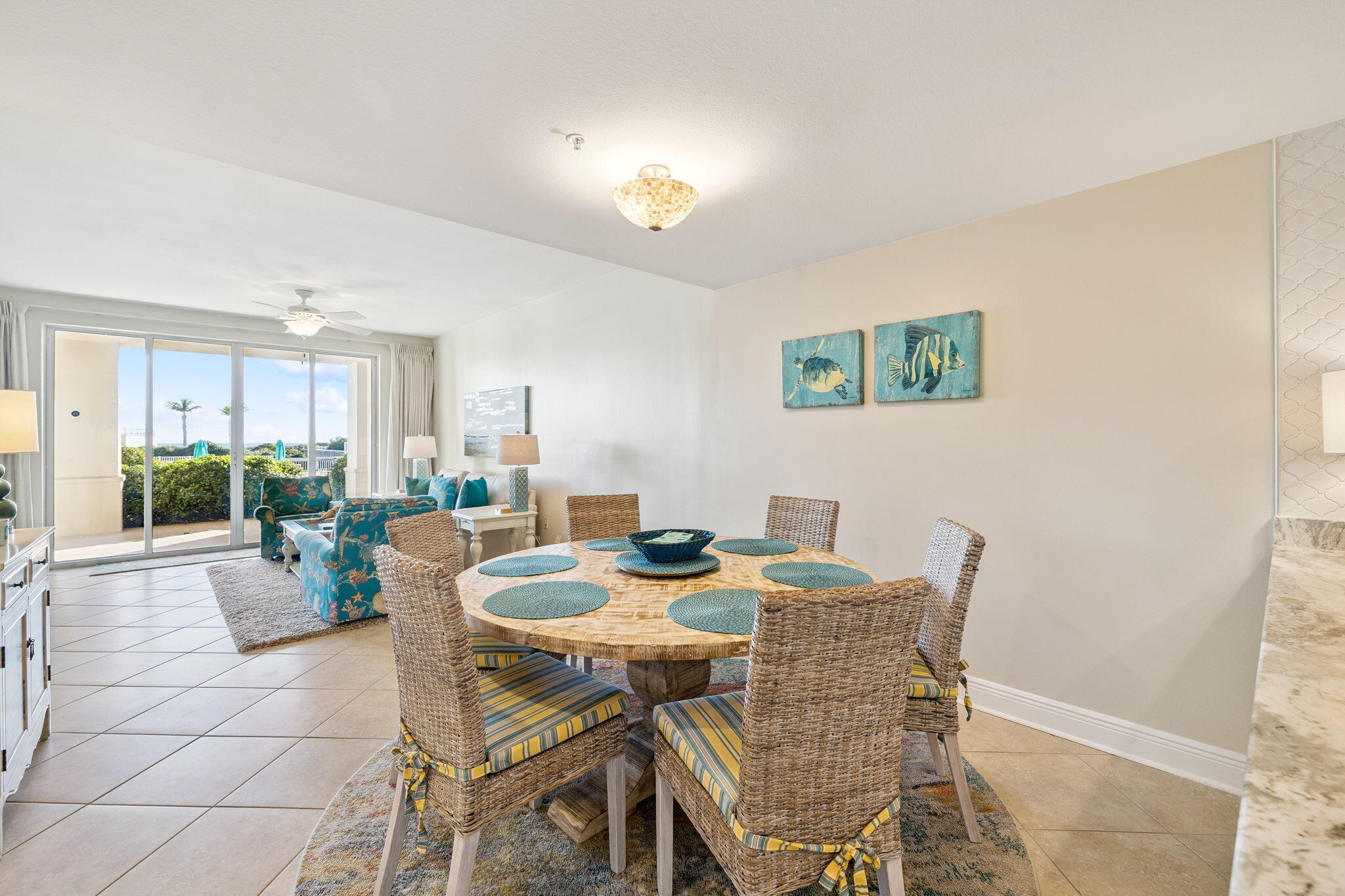 4045 West County Highway 30A, Unit 108 Santa Rosa Beach, FL 32459 - Photo 8 of 29 a view of a dining room with furniture and a potted plant