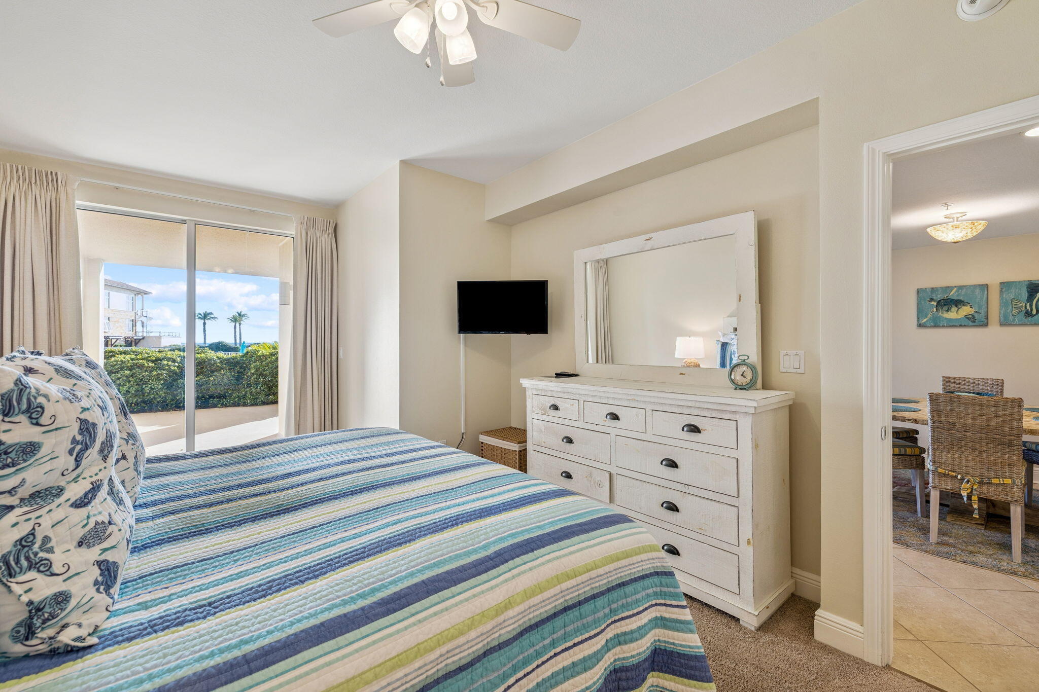 4045 West County Highway 30A, Unit 108 Santa Rosa Beach, FL 32459 - Photo 9 of 29 a bedroom with a bed and a flat screen tv