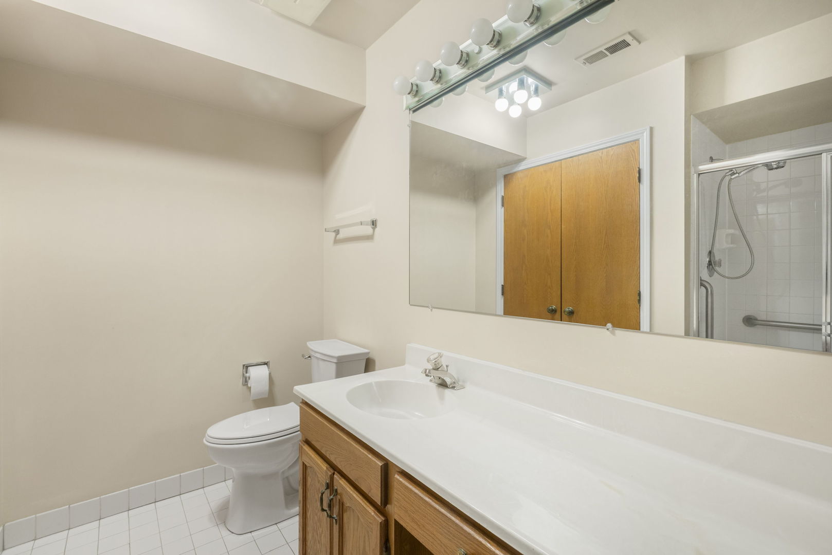 400 East Dundee Road, Unit 403C Buffalo Grove, IL 60089 - Photo 13 of 20 a bathroom with a sink a toilet and shower