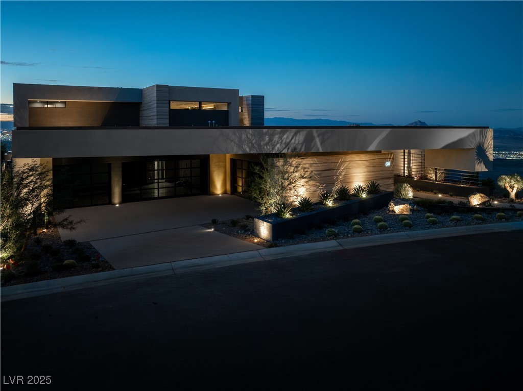 607 Alpine Summit Drive Henderson, NV 89012 - Photo 1 of 1 Modern home with stucco siding, concrete driveway, and a garage