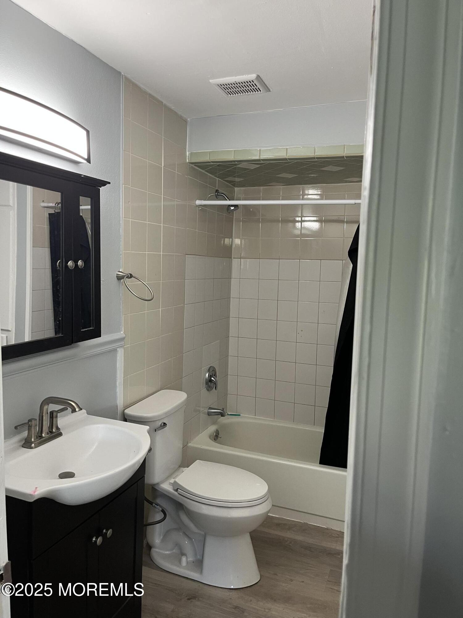 140 Main Street Helmetta, NJ 08828 - Photo 3 of 5 a bathroom with a sink a toilet and shower