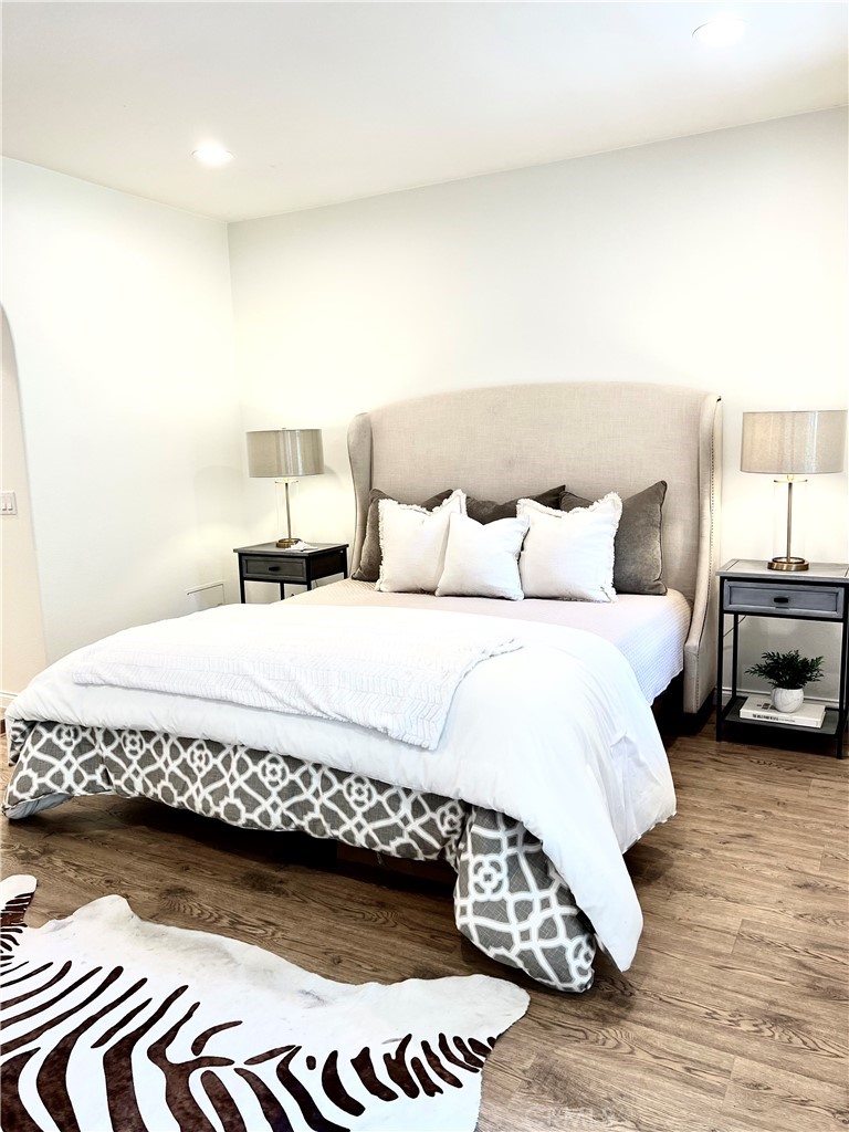 a bedroom with a bed and a couch