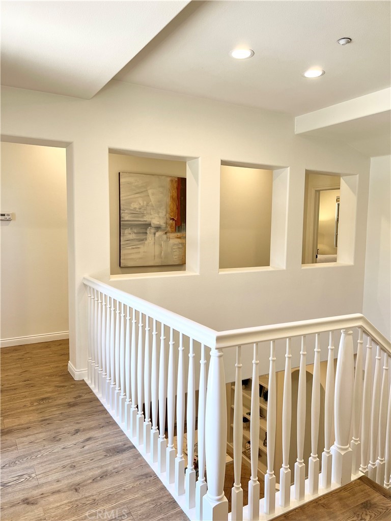 22 San Sovino Newport Coast, CA 92657 - Photo 5 of 20 a view of a hallway with wooden floor and windows
