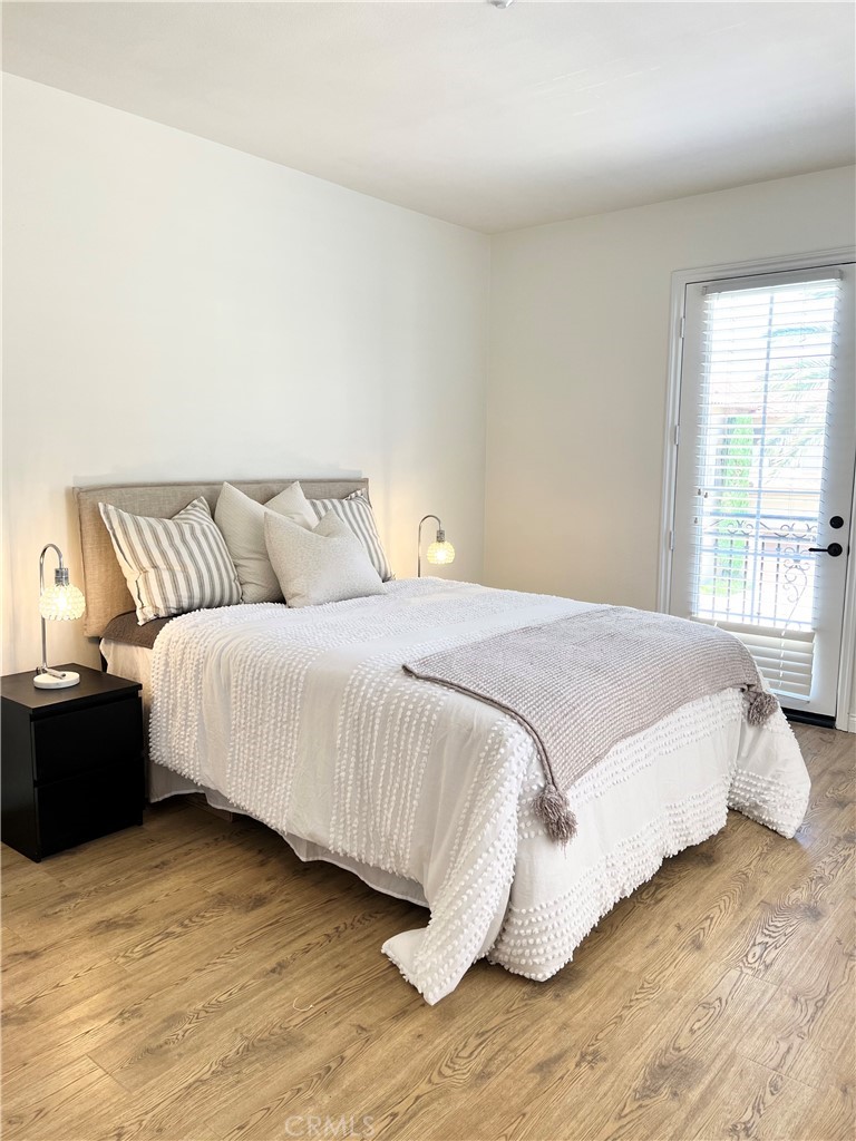 22 San Sovino Newport Coast, CA 92657 - Photo 6 of 20 a bedroom with a bed and wooden floor