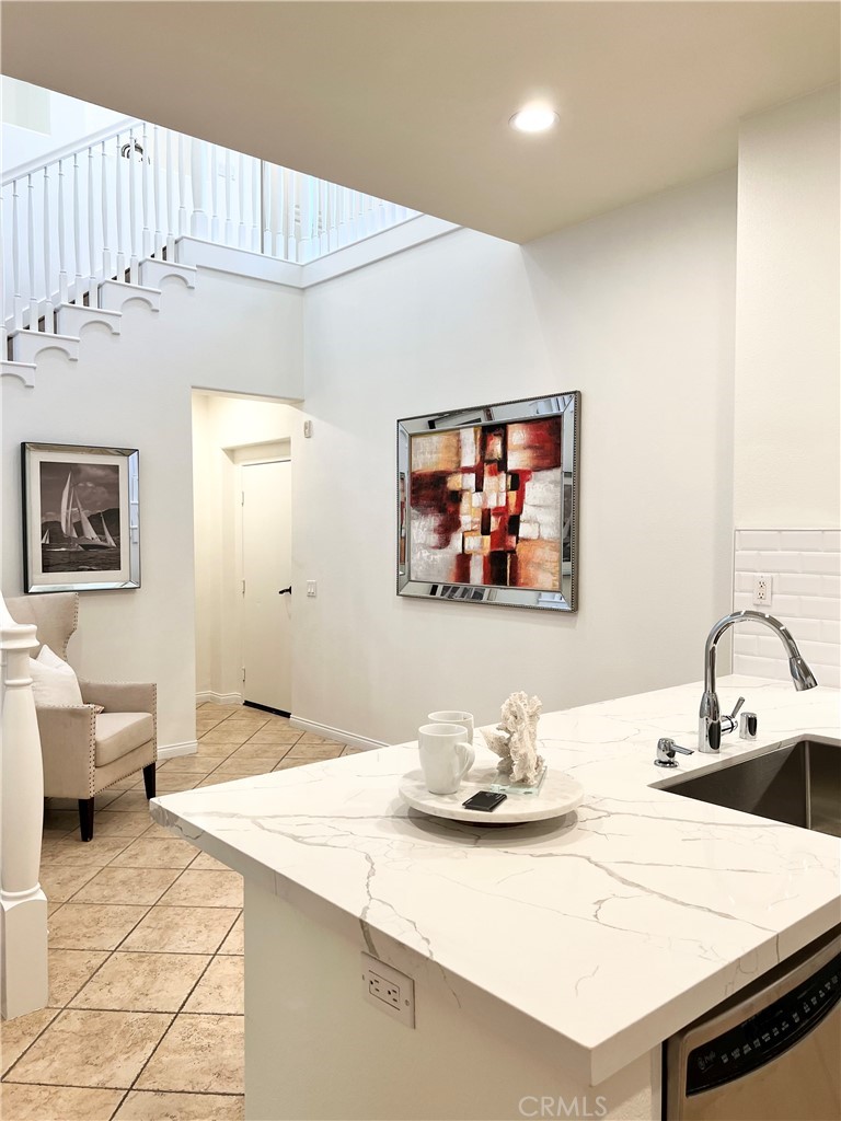 22 San Sovino Newport Coast, CA 92657 - Photo 8 of 20 a bedroom with furniture and a chandelier